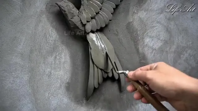ویدیو دیدنی خلق نقاشی برجسته روی دیوار با سیمان